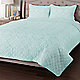 Seafoam quilt on bed