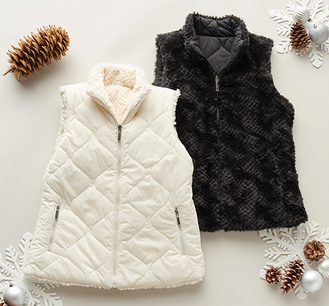 A pair of outdoor, winter vests.