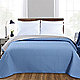 Blue coverlet on bed
