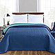Teal coverlet on bed